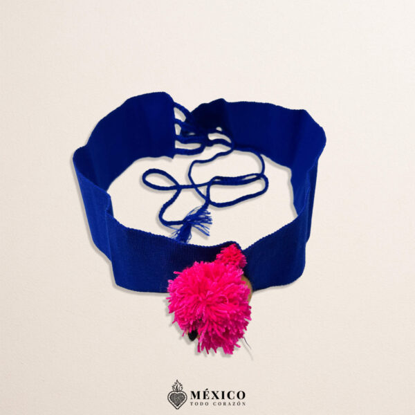 Blue artisan Mexican waist belt featuring a lion embellishment with a pink mane
