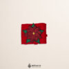 Red Mexican waist belt featuring a poinsettia embellishment crafted in felt