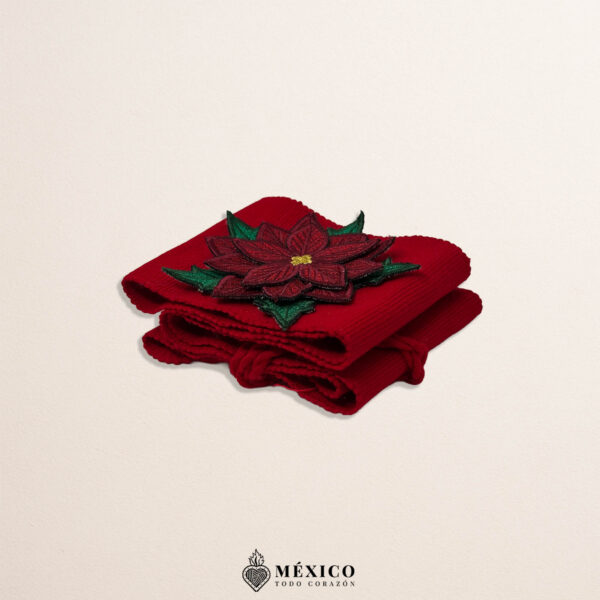 Red Mexican waist belt featuring a poinsettia embellishment crafted in felt