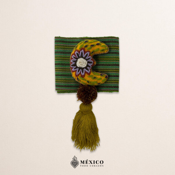 Green artisan Mexican waist belt featuring a floral moon embellishment in felt appliqué