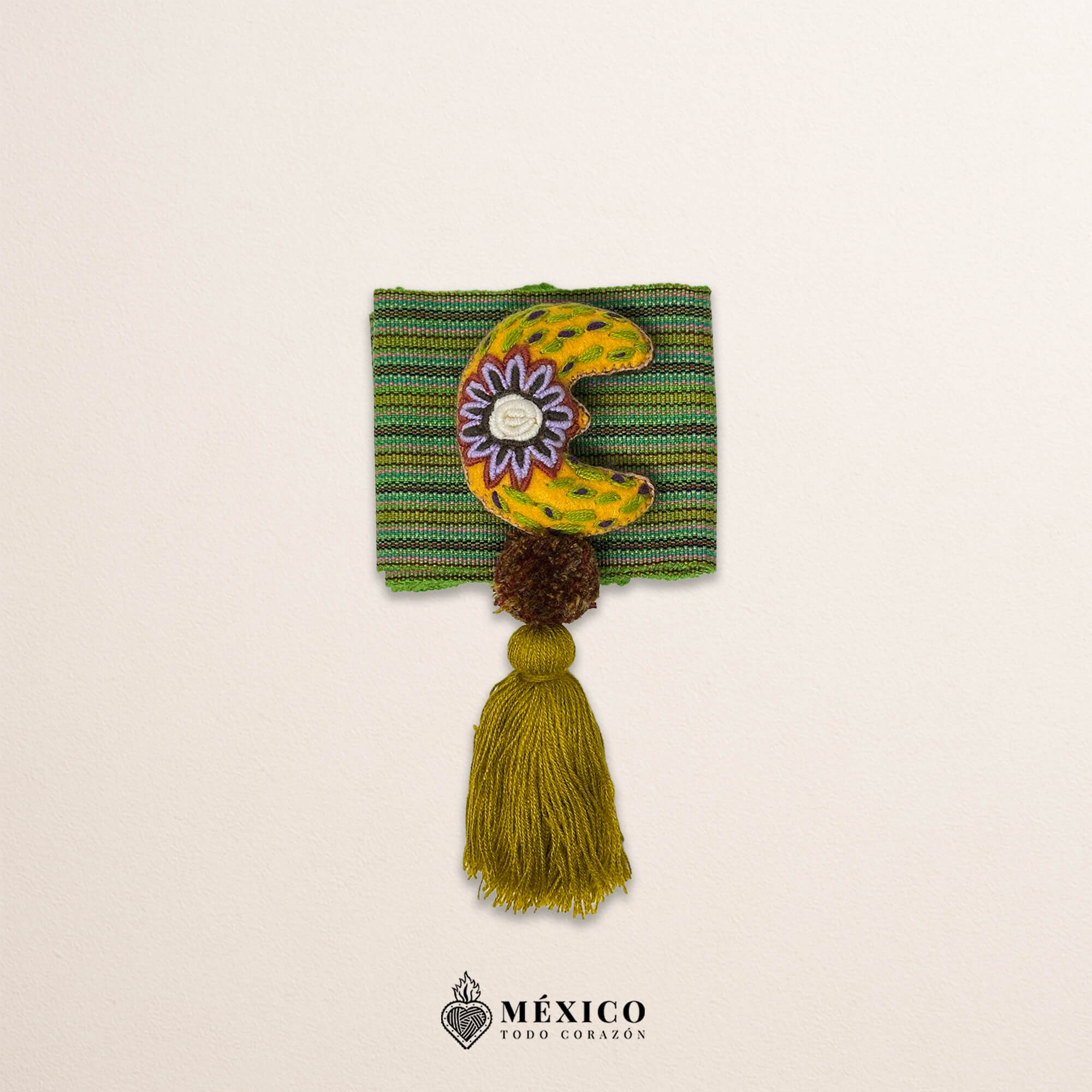 Green artisan Mexican waist belt featuring a floral moon embellishment in felt appliqué