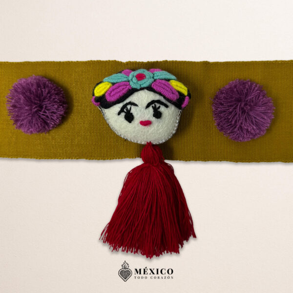 Beige artisan waist belt featuring a Mexican doll embellishment with multicolor pom-poms