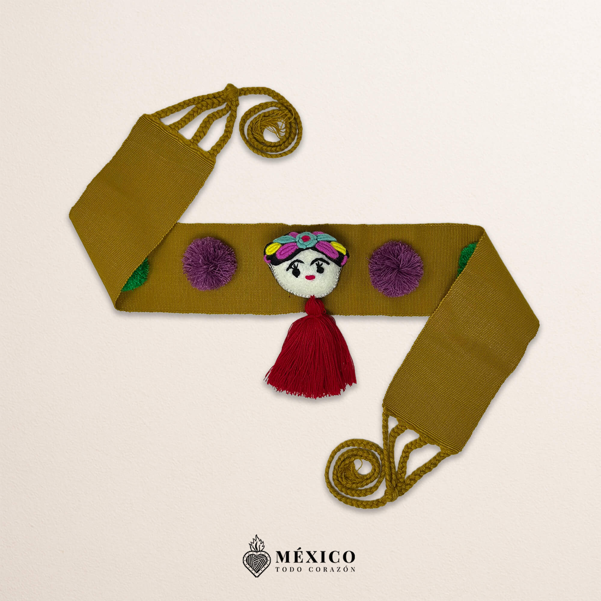 Beige artisan waist belt featuring a Mexican doll embellishment with multicolor pom-poms