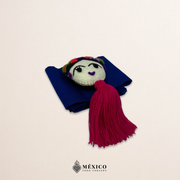 Blue artisan waist belt featuring floral embroidery and a Mexican doll embellishment
