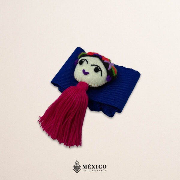 Blue artisan waist belt featuring floral embroidery and a Mexican doll embellishment