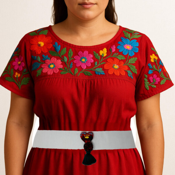 White artisan Mexican waist belt featuring a heart embellishment with a scenic landscape design