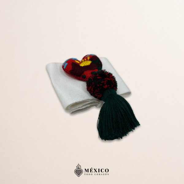 White artisan Mexican waist belt featuring a heart embellishment with a scenic landscape design