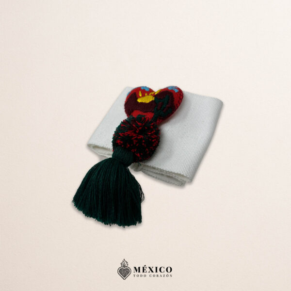 White artisan Mexican waist belt featuring a heart embellishment with a scenic landscape design