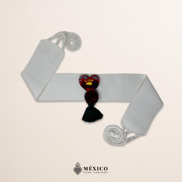 White artisan Mexican waist belt featuring a heart embellishment with a scenic landscape design