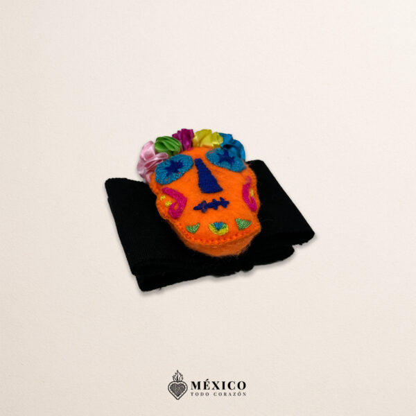 Black artisan Mexican waist belt featuring an orange Catrina embellishment in felt appliqué