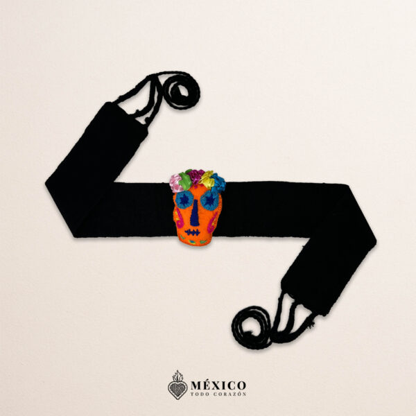 Black artisan Mexican waist belt featuring an orange Catrina embellishment in felt appliqué