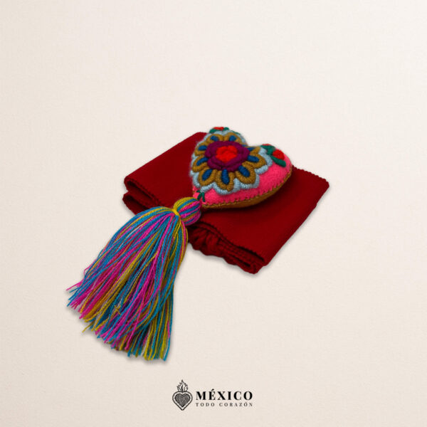 Red artisan Mexican waist belt featuring a floral heart embellishment in felt appliqué