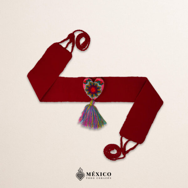 Red artisan Mexican waist belt featuring a floral heart embellishment in felt appliqué