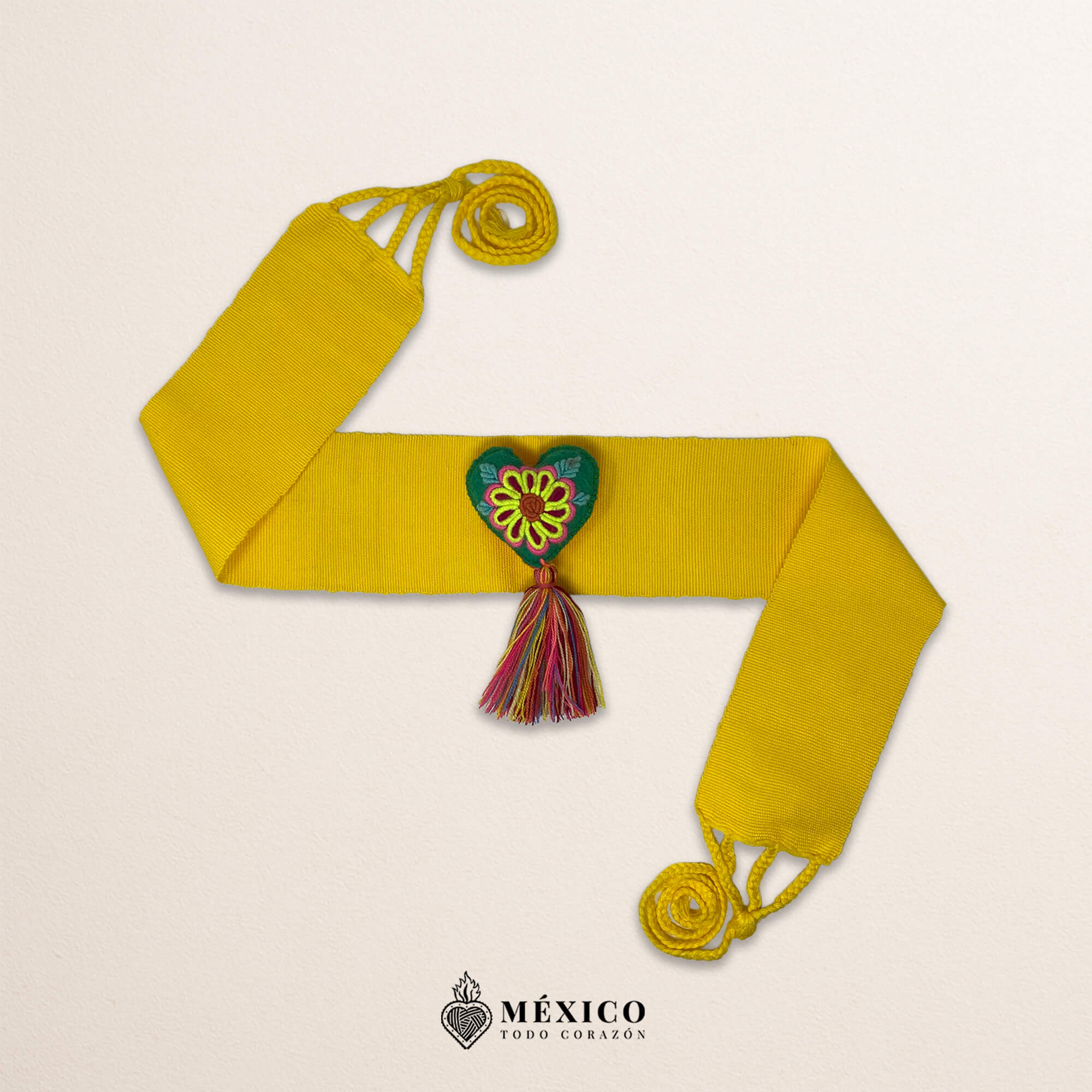 Yellow artisan Mexican waist belt featuring a floral heart embellishment in multicolor felt