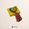 Yellow artisan Mexican waist belt featuring a floral heart embellishment in multicolor felt