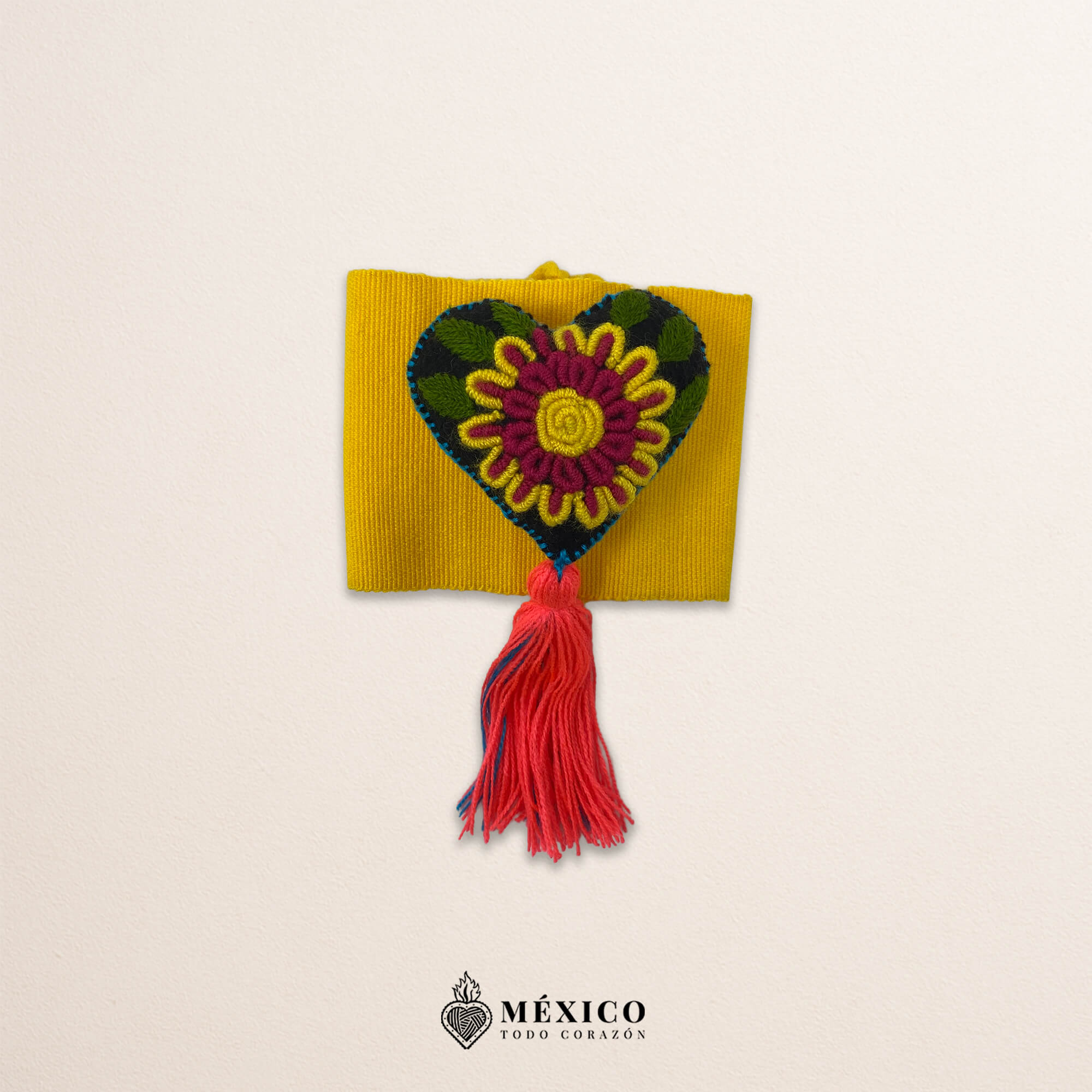 Yellow artisan Mexican waist belt featuring a floral heart embellishment in felt appliqué