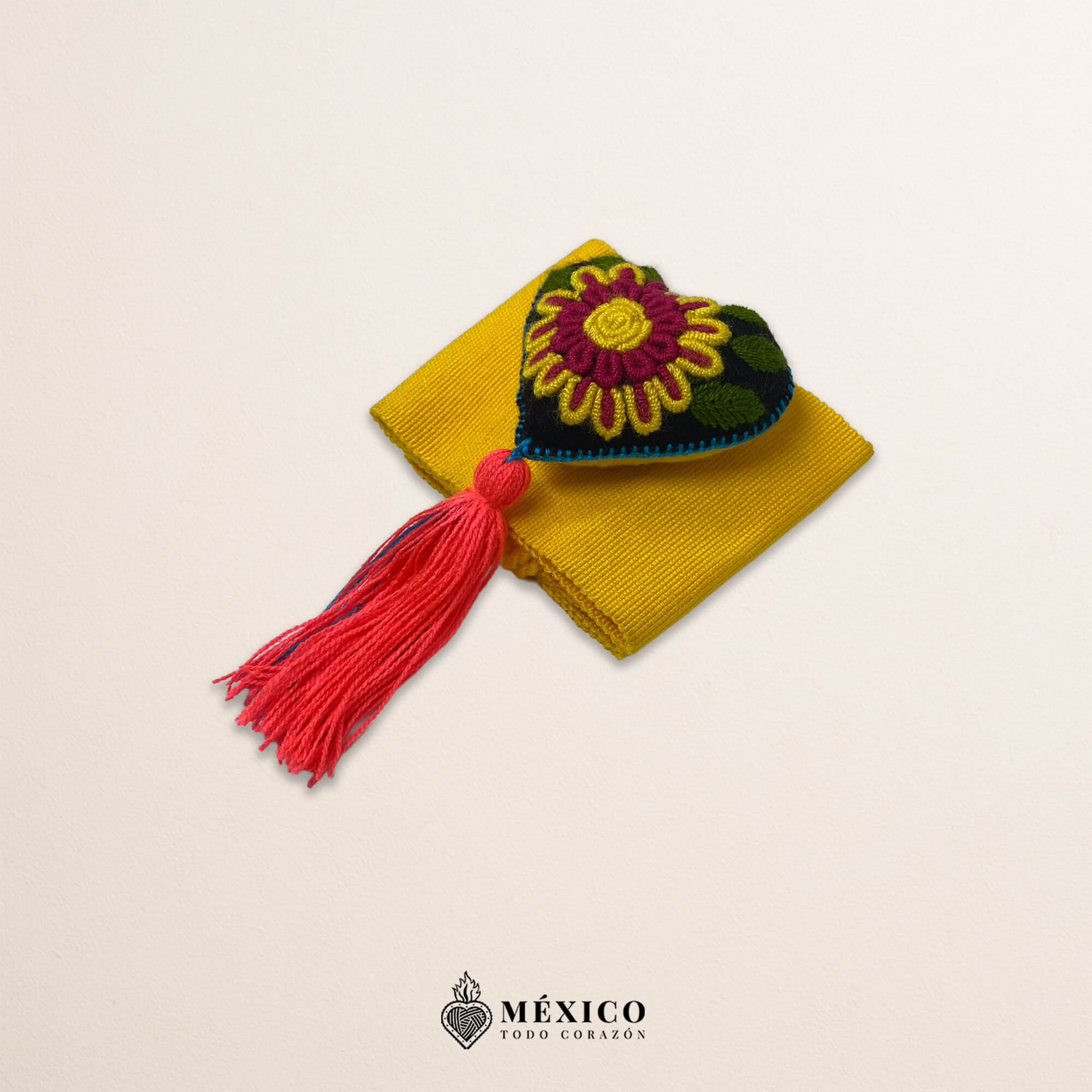 Yellow artisan Mexican waist belt featuring a floral heart embellishment in felt appliqué