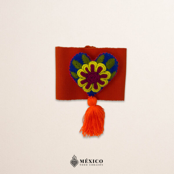 Orange artisan Mexican waist belt featuring a floral heart embellishment in felt appliqué