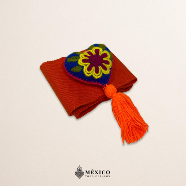 Orange artisan Mexican waist belt featuring a floral heart embellishment in felt appliqué
