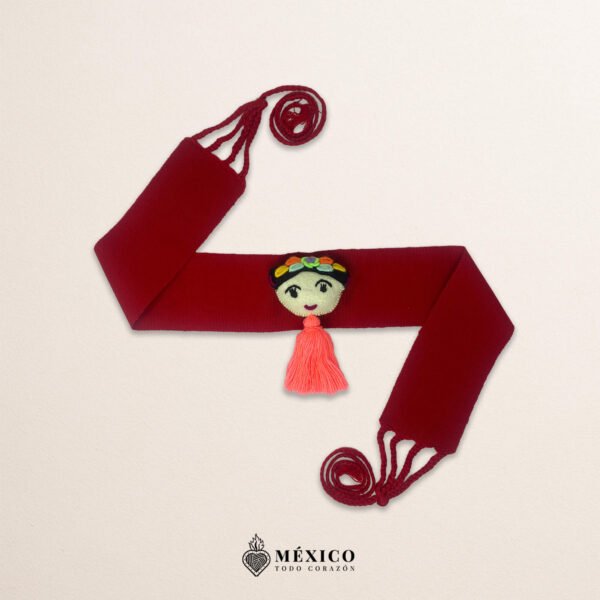 Red artisan Mexican waist belt featuring a Mexican doll embellishment in felt appliqué