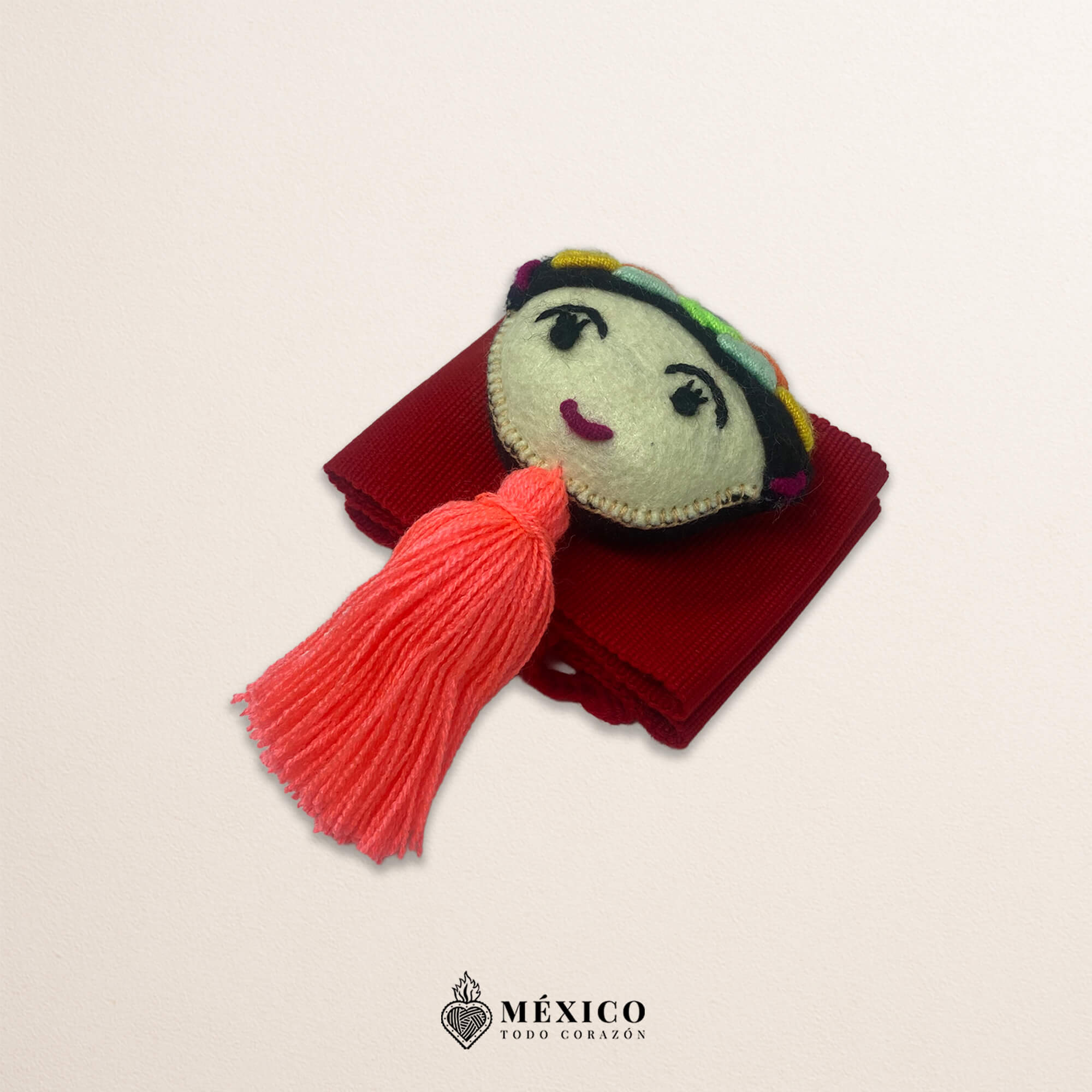 Red artisan Mexican waist belt featuring a Mexican doll embellishment in felt appliqué