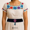 Black artisan Mexican waist belt featuring a floral heart embellishment in felt appliqué