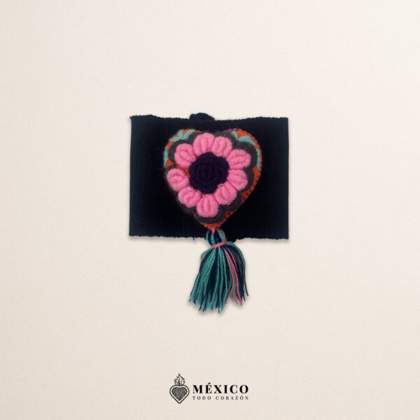 Black artisan Mexican waist belt featuring a floral heart embellishment in felt appliqué