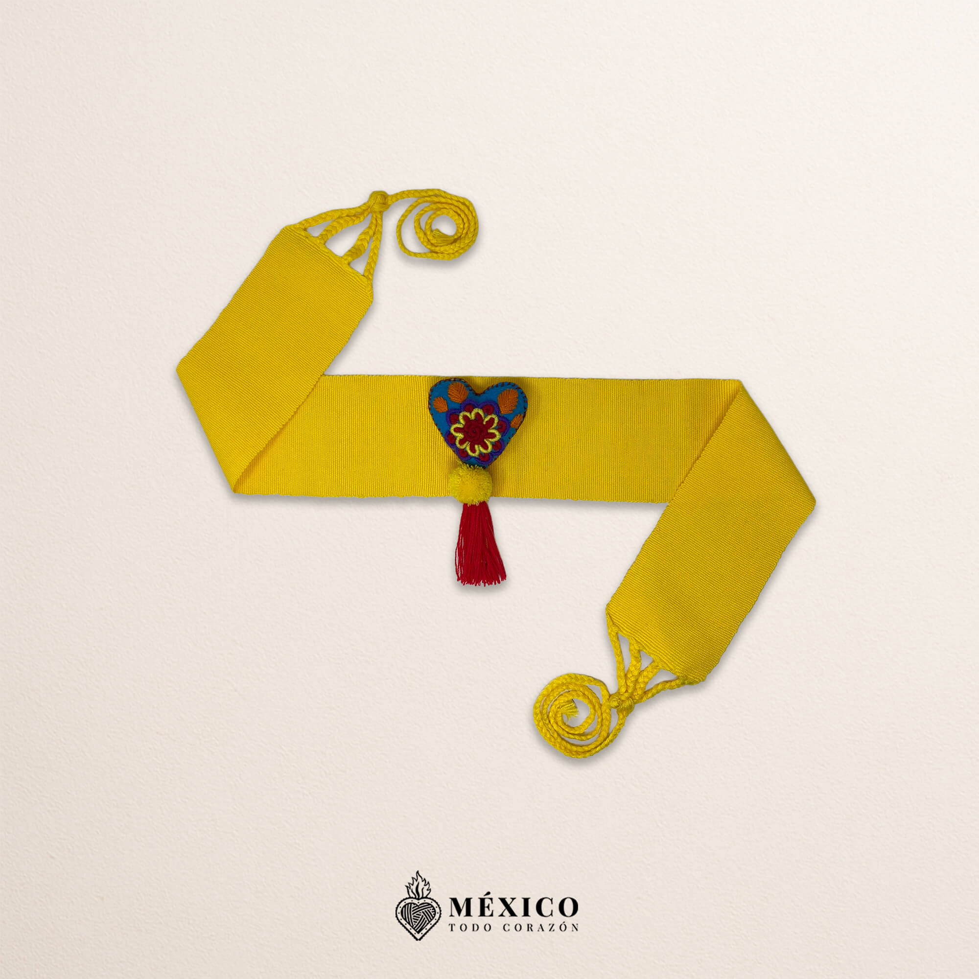 Yellow artisan Mexican waist belt featuring a floral heart embellishment in multicolor felt
