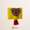 Yellow artisan Mexican waist belt featuring a floral heart embellishment in multicolor felt