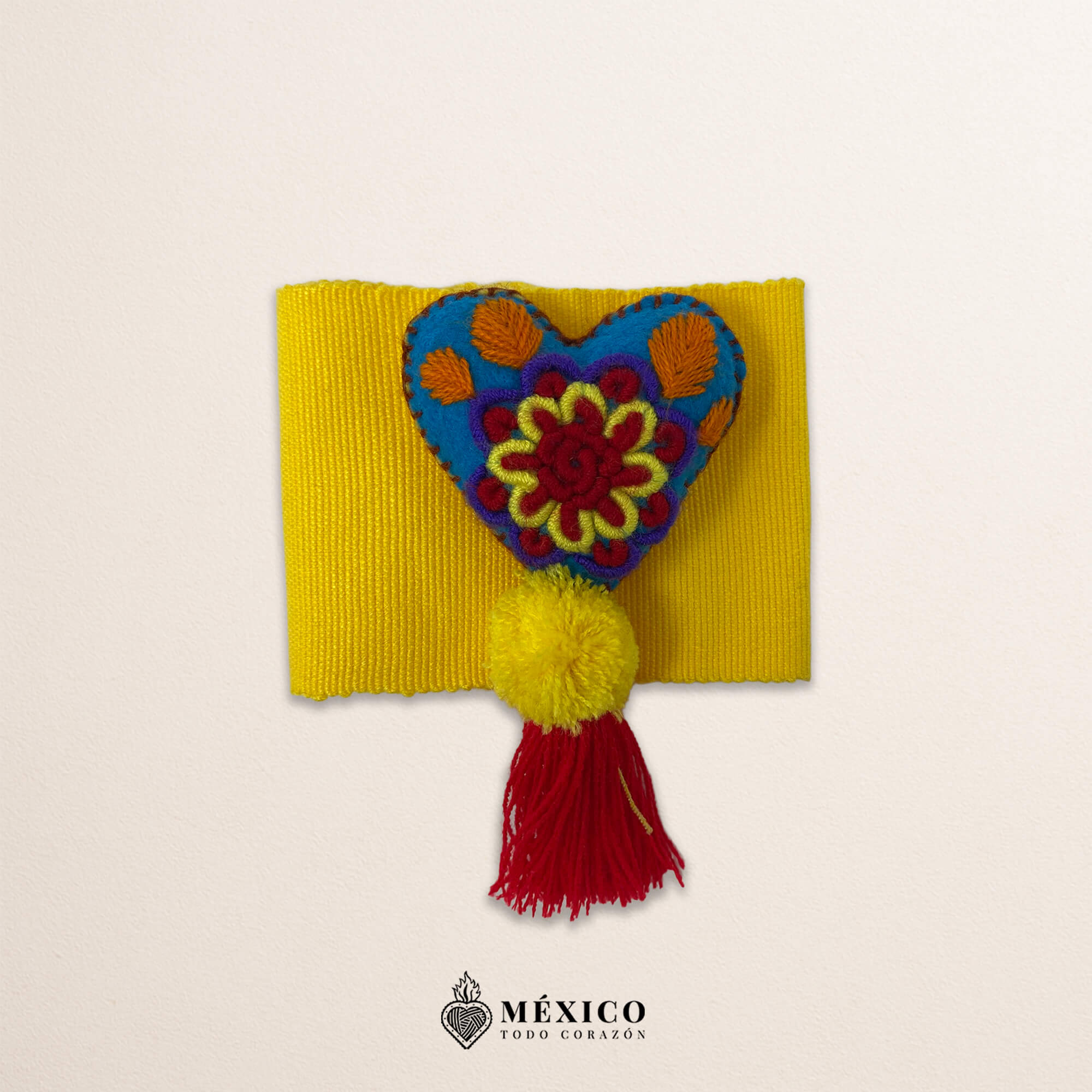 Yellow artisan Mexican waist belt featuring a floral heart embellishment in multicolor felt