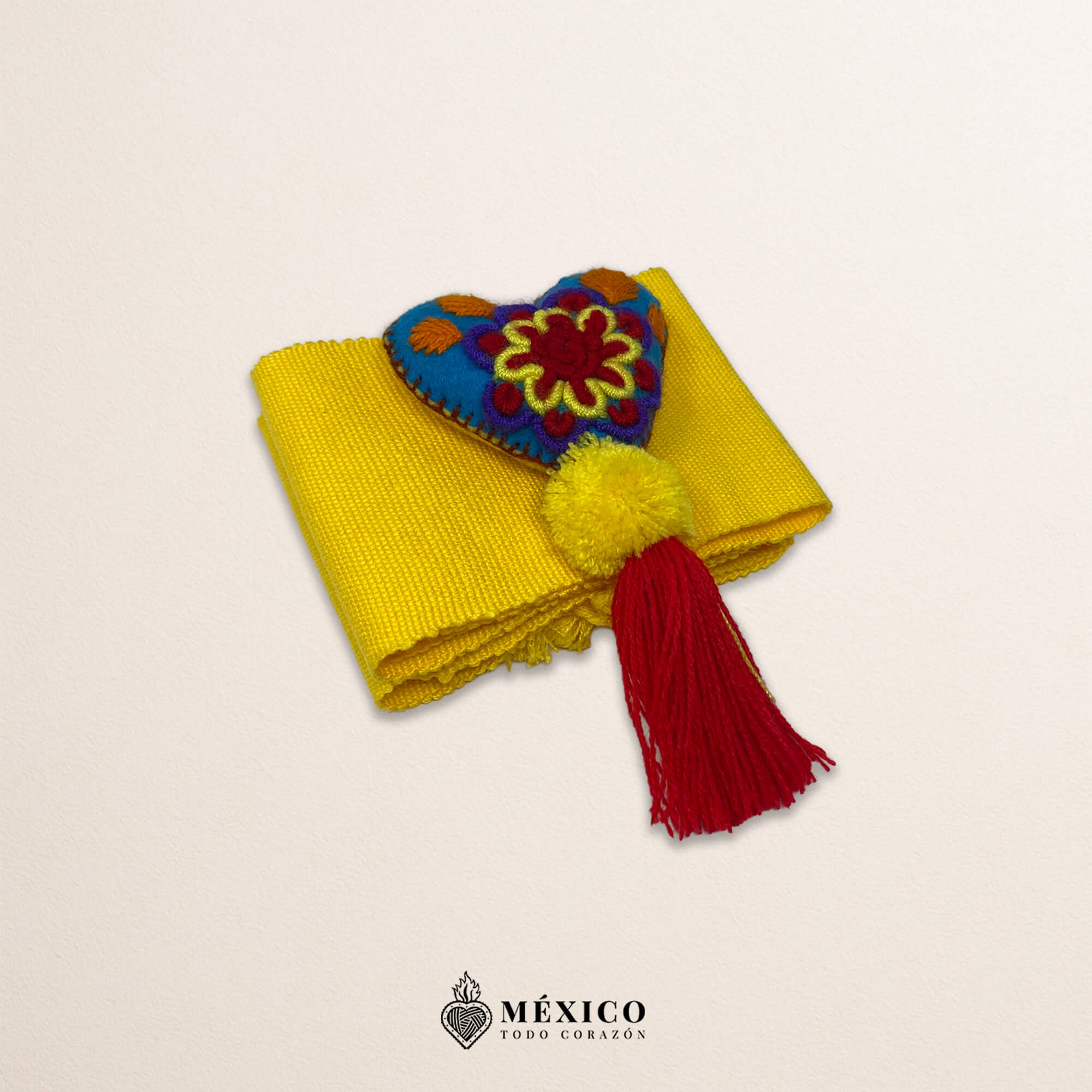 Yellow artisan Mexican waist belt featuring a floral heart embellishment in multicolor felt