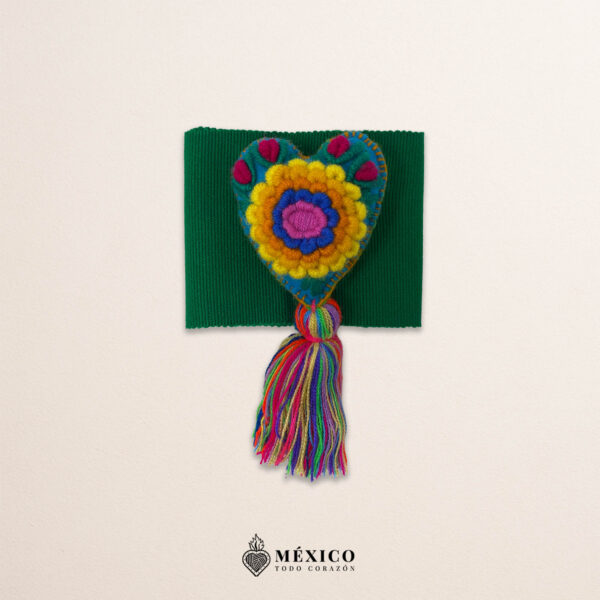 Green artisan Mexican waist belt featuring a floral heart embellishment in multicolor felt