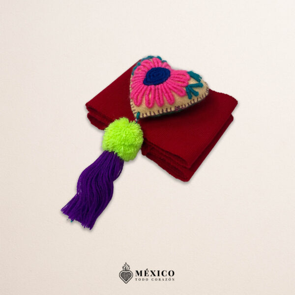 Red artisan waist belt featuring floral embroidery and a heart embellishment in multicolor felt