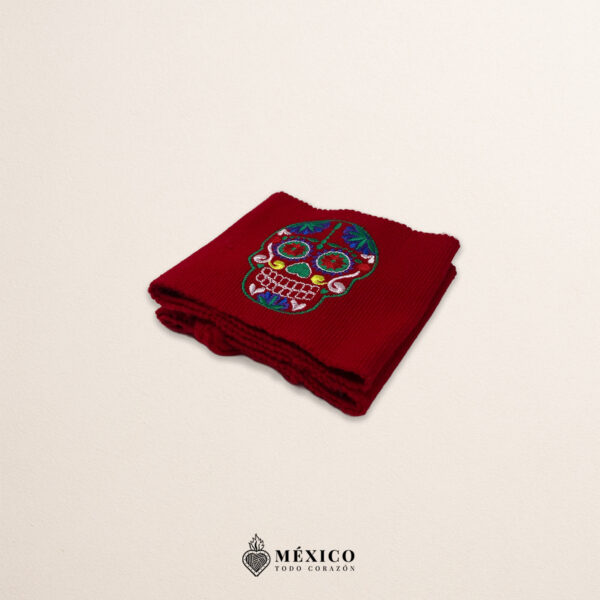 Handcrafted red Mexican waist belt (faja) featuring colorful sugar skull embroidery