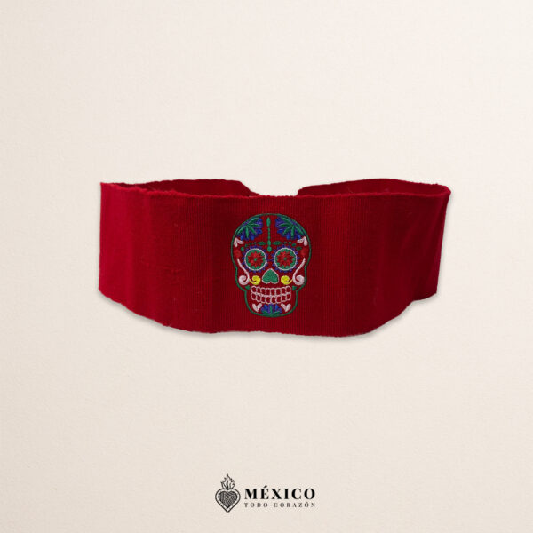Handcrafted red Mexican waist belt (faja) featuring colorful sugar skull embroidery