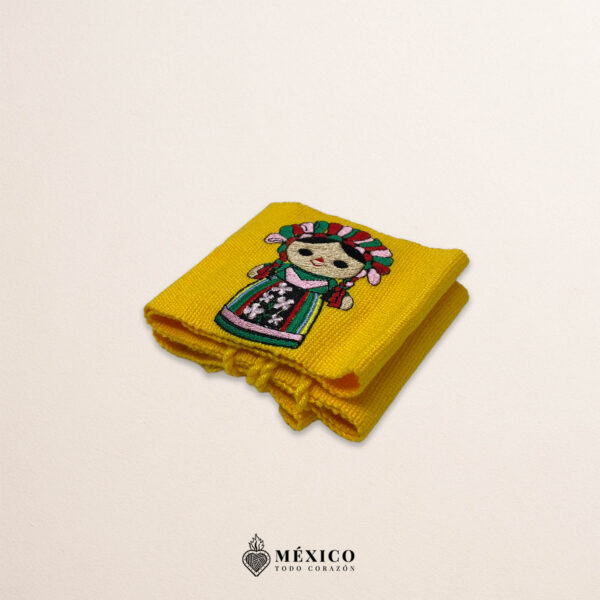 Handcrafted yellow faja waist belt featuring traditional Mexican doll embroidery