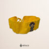Handcrafted yellow faja waist belt featuring traditional Mexican doll embroidery