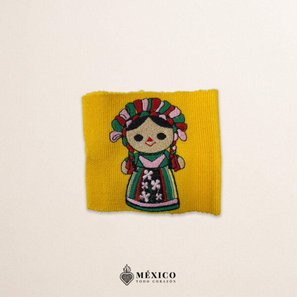 Handcrafted yellow faja waist belt featuring traditional Mexican doll embroidery