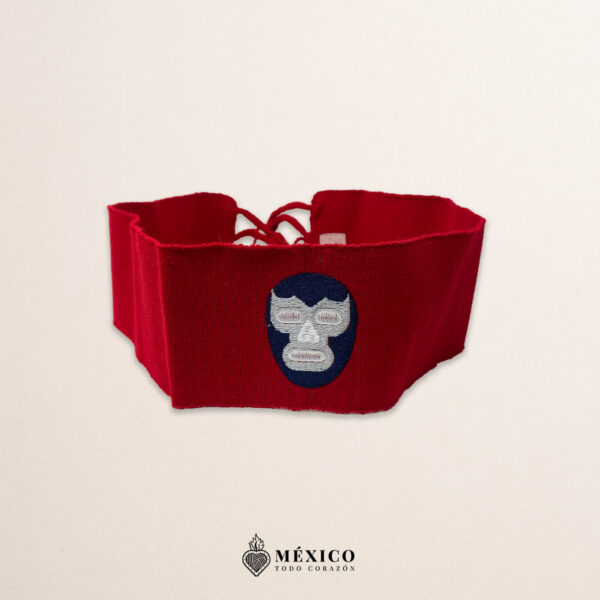 Handcrafted red faja Mexican waist belt featuring an embroidered luchador mask design