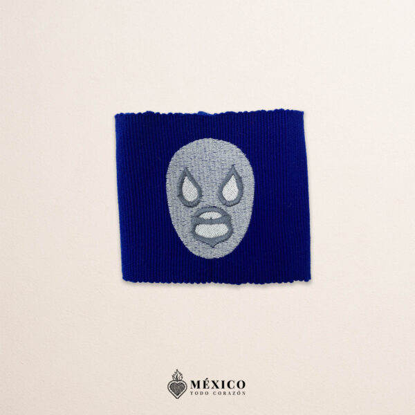 Handcrafted blue faja Mexican waist belt featuring an embroidered luchador mask design