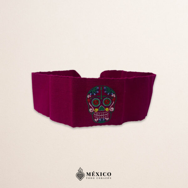 Handcrafted wine red faja Mexican waist belt featuring colorful sugar skull embroidery