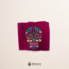 Handcrafted wine red faja Mexican waist belt featuring colorful sugar skull embroidery