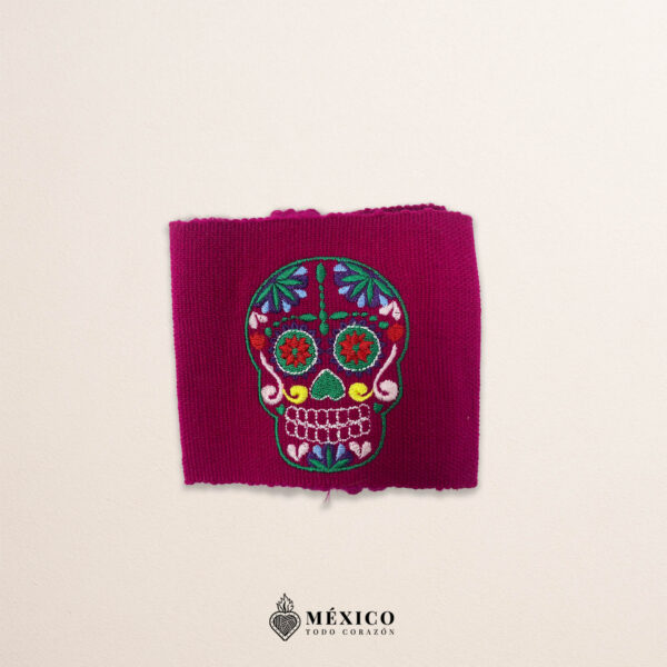 Handcrafted wine red faja Mexican waist belt featuring colorful sugar skull embroidery