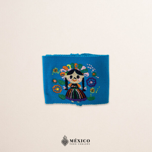 Handcrafted light blue faja Mexican waist belt featuring mini Mexican doll embroidery