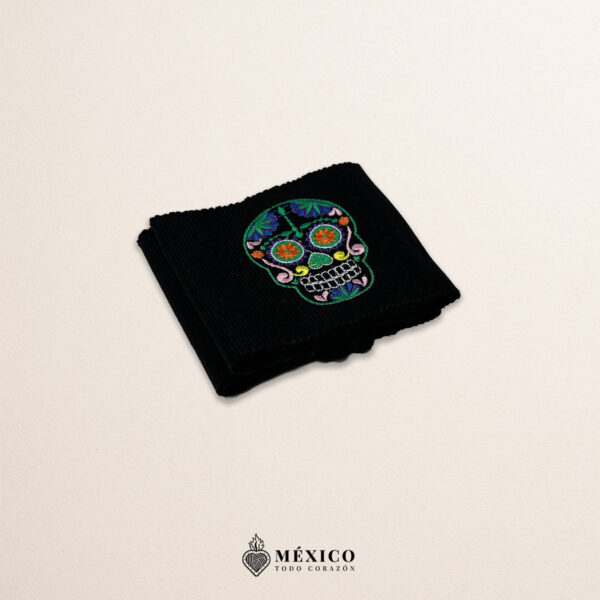 Handcrafted black faja Mexican waist belt featuring sugar skull embroidery
