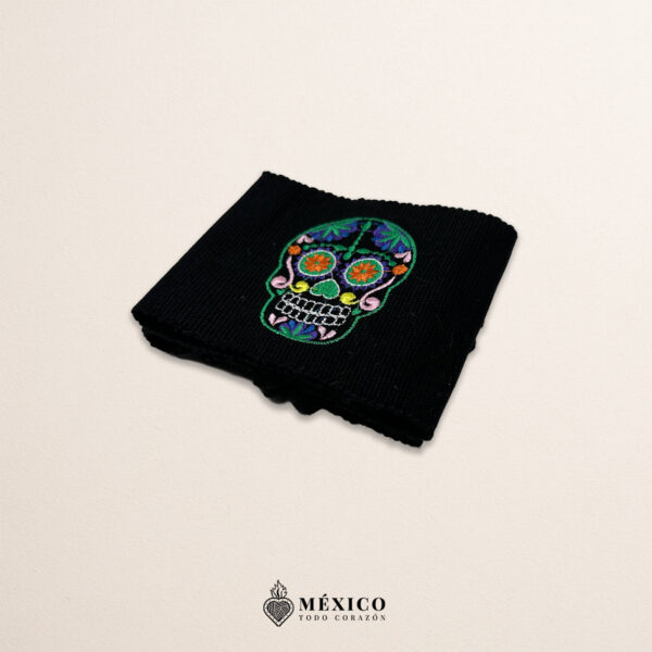 Handcrafted black faja Mexican waist belt featuring sugar skull embroidery