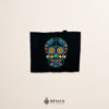 Handcrafted black faja Mexican waist belt featuring sugar skull embroidery
