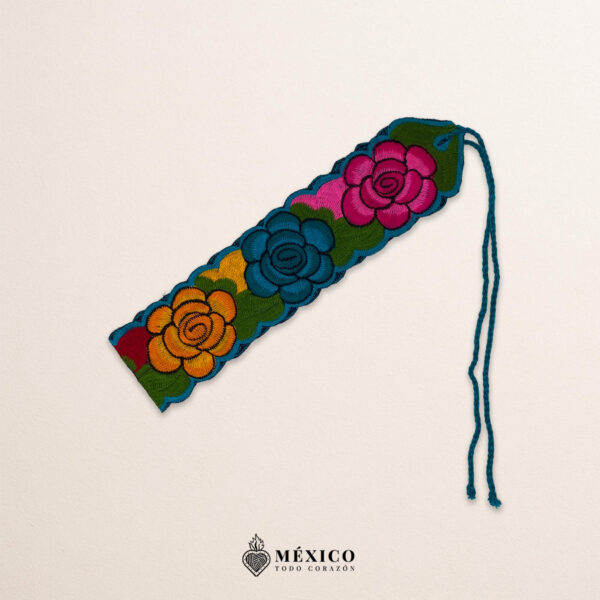 Handwoven small Mexican waist belt (faja) featuring colorful flower embellishments and blue ties