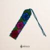 Handwoven small Mexican waist belt (faja) featuring colorful flower embellishments and blue ties