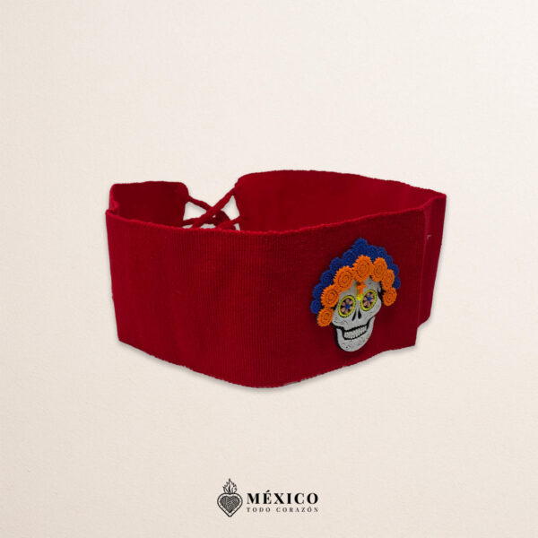 Red artisan Mexican waist belt featuring a Catrina felt appliqué